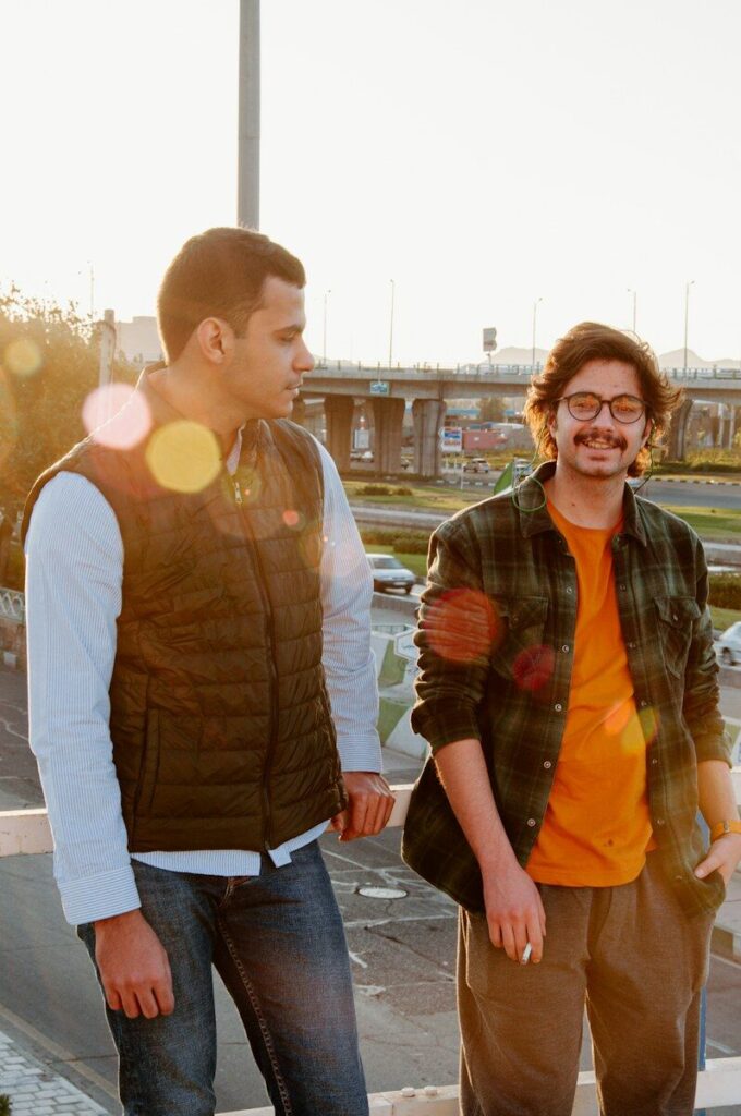 a couple of men standing next to each other